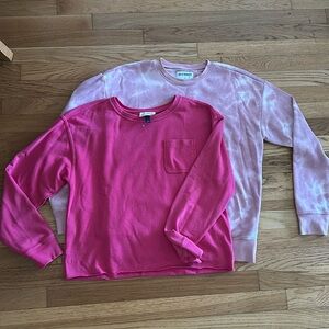 Two pink sweatshirts